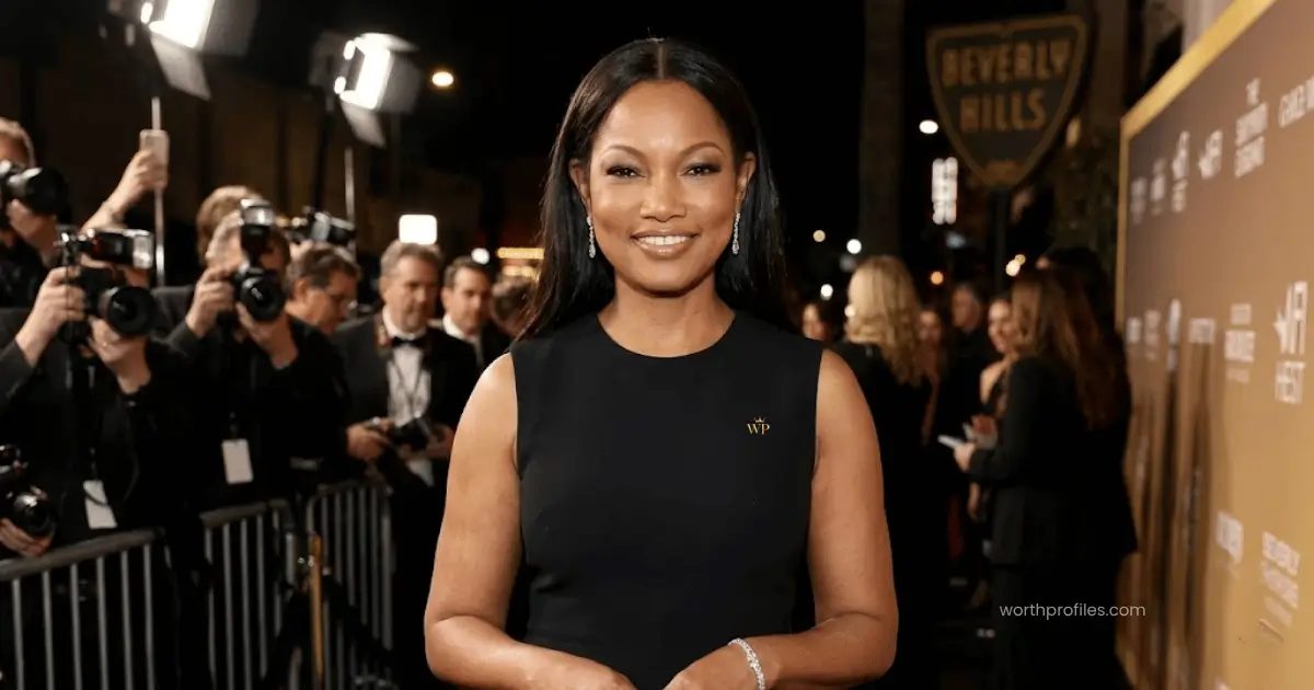 Home 11 Garcelle Beauvais attending a red carpet event in a glamorous black dress